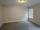 Large bedroom featuring a window and neutral walls at 2137 Meadow Peak Rd, Duluth, GA 30097