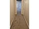 Hallway with neutral carpeting leading to a bright, open space at 2137 Meadow Peak Rd, Duluth, GA 30097