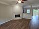 Open-concept living room boasts modern fireplace and open access to the kitchen at 2137 Meadow Peak Rd, Duluth, GA 30097