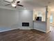 Open-concept living room boasts modern fireplace and open access to the kitchen at 2137 Meadow Peak Rd, Duluth, GA 30097