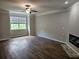 Spacious living room with luxury vinyl plank flooring and a modern fireplace at 2137 Meadow Peak Rd, Duluth, GA 30097