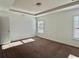 Serene bedroom with neutral carpet, tray ceiling, and plenty of natural light at 3677 Hidden Valley Cir, Lawrenceville, GA 30044