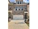 Charming brick townhome with a two-car garage and inviting curb appeal at 3677 Hidden Valley Cir, Lawrenceville, GA 30044