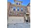 Stylish townhome featuring a brick facade and a convenient two-car garage at 3677 Hidden Valley Cir, Lawrenceville, GA 30044