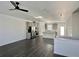 Spacious open-concept living space featuring hardwood floors and stainless steel appliances at 3677 Hidden Valley Cir, Lawrenceville, GA 30044