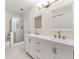 Stylish bathroom with double vanity, modern fixtures, and glass-enclosed shower at 3040 Majestic Park Ct, Duluth, GA 30096