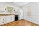 Bright kitchen featuring white cabinets, a black dishwasher, and a stainless-steel sink at 3040 Majestic Park Ct, Duluth, GA 30096