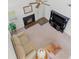 Aerial view of a cozy living room with a fireplace, entertainment center, and comfortable seating at 3040 Majestic Park Ct, Duluth, GA 30096