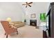 Bright living room with fireplace and access to deck through sliding glass doors at 3040 Majestic Park Ct, Duluth, GA 30096