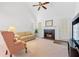 Bright living room with fireplace and access to deck through sliding glass doors at 3040 Majestic Park Ct, Duluth, GA 30096