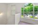 Bright stairwell featuring large arched window providing ample natural light and outside views at 3040 Majestic Park Ct, Duluth, GA 30096
