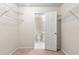 Spacious walk-in closet with wire shelving and access to a bathroom at 3040 Majestic Park Ct, Duluth, GA 30096