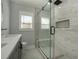 Beautifully renovated bathroom with black fixtures and a luxurious glass enclosed shower with built-in niche at 3470 Glenwood Rd, Decatur, GA 30032