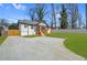 Well-maintained home with a lovely front yard, spacious driveway and inviting entrance at 3470 Glenwood Rd, Decatur, GA 30032