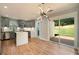Stylish kitchen with stainless appliances, a kitchen island and sliding door access to the back yard at 3470 Glenwood Rd, Decatur, GA 30032