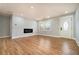 Bright living room featuring hardwood floors, a modern fireplace, and plenty of natural light at 3470 Glenwood Rd, Decatur, GA 30032