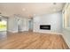 Spacious living area with wood floors, recessed lighting and a stylish electric fireplace at 3470 Glenwood Rd, Decatur, GA 30032