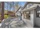 Back deck is constructed of gray wood and overlooks the house next door and tree line at 3966 N Indian Nw Cir, Kennesaw, GA 30144