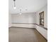 Basement featuring neutral carpet, wood trim, window and ceiling lighting at 3966 N Indian Nw Cir, Kennesaw, GA 30144