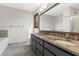 Bathroom features a double sink vanity with granite countertop and tiled floor at 3966 N Indian Nw Cir, Kennesaw, GA 30144
