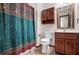 Bathroom featuring wood vanity, patterned shower curtain, and tile floor at 3966 N Indian Nw Cir, Kennesaw, GA 30144