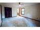 Spacious bedroom with a ceiling fan, large closet, and carpet flooring throughout at 3966 N Indian Nw Cir, Kennesaw, GA 30144