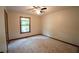 Bedroom featuring carpet flooring, a window for natural light, and a ceiling fan at 3966 N Indian Nw Cir, Kennesaw, GA 30144