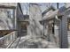 Back deck is spacious and constructed of gray wood, offers access to the house and has surrounding trees at 3966 N Indian Nw Cir, Kennesaw, GA 30144