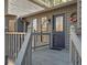 View of the front door and porch with decorative wreath and multiple panes of glass at 3966 N Indian Nw Cir, Kennesaw, GA 30144