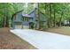 Charming two-story home featuring a two-car garage, and a long driveway, surrounded by mature trees at 3966 N Indian Nw Cir, Kennesaw, GA 30144