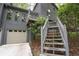 A close-up of the home's exterior with a staircase leading to the front door at 3966 N Indian Nw Cir, Kennesaw, GA 30144