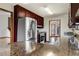 Kitchen featuring stainless steel appliances, dark wood cabinetry, granite counters and peninsula seating at 3966 N Indian Nw Cir, Kennesaw, GA 30144