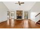 Spacious living room with a stone fireplace, hardwood floors, and natural light at 3966 N Indian Nw Cir, Kennesaw, GA 30144