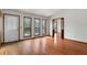 Living room view with beautiful hardwood floors, a stained-glass front door, and natural light at 3966 N Indian Nw Cir, Kennesaw, GA 30144