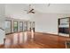 Spacious living room with wood floors, multiple windows, and a ceiling fan at 3966 N Indian Nw Cir, Kennesaw, GA 30144