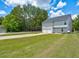 Large backyard with spacious lawn and two car garage at 6684 Crane Ave, Fairburn, GA 30213