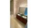 Bathroom with dual sink vanity, spacious countertop and modern light fixtures at 6684 Crane Ave, Fairburn, GA 30213