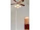 Bright bedroom with a ceiling fan and entry door visible at 6684 Crane Ave, Fairburn, GA 30213