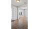 Welcoming entryway with stylish light wood floors, white trim, and a view into the chandeliered dining room at 6684 Crane Ave, Fairburn, GA 30213