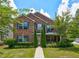 Charming two-story brick home with manicured lawn, beautiful landscaping, and classic curb appeal at 6684 Crane Ave, Fairburn, GA 30213