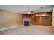 Bright living room boasting recessed lighting, fireplace, and smooth wood laminate flooring at 6684 Crane Ave, Fairburn, GA 30213