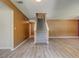 Spacious living room features wood floors, fireplace, and stairs to the second floor at 6684 Crane Ave, Fairburn, GA 30213