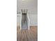Bright interior shot featuring a carpeted staircase, light wood floors, and neutral wall colors at 6684 Crane Ave, Fairburn, GA 30213