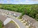 Aerial shot of townhome community with well-maintained lawns and mature trees at 5057 Lower Elm St, Atlanta, GA 30349