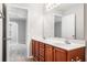 Bathroom features a double vanity, tile flooring, and a large mirror at 5057 Lower Elm St, Atlanta, GA 30349