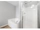 Bright bathroom with separate shower and soaking tub at 5057 Lower Elm St, Atlanta, GA 30349