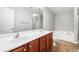 Bathroom features a double vanity with a bathtub and separate shower at 5057 Lower Elm St, Atlanta, GA 30349