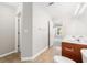 Bathroom features double vanity with tile flooring and access to a bedroom at 5057 Lower Elm St, Atlanta, GA 30349