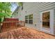 Exterior home view of wood patio, wood fence, and the side of the house at 5057 Lower Elm St, Atlanta, GA 30349