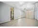 Spacious garage with an attached water heater and roll up garage door at 5057 Lower Elm St, Atlanta, GA 30349